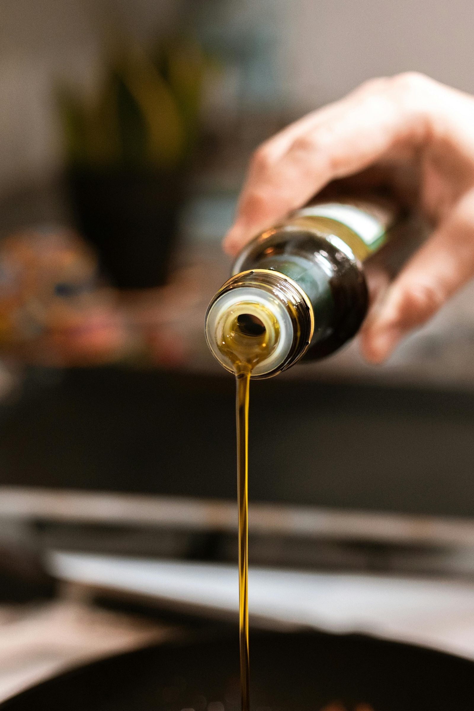 Habanero chili oil drizzling onto a pasta dish