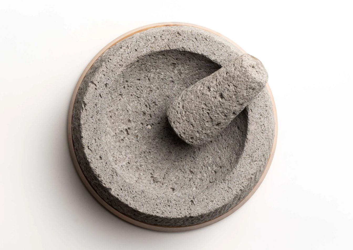 Molcajete with crushed garlic and herbs ready to serve