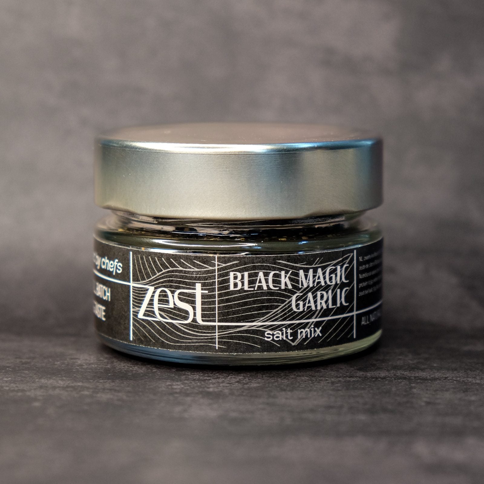 Black Magic black garlic finishing salt in glass jar with ZEST label