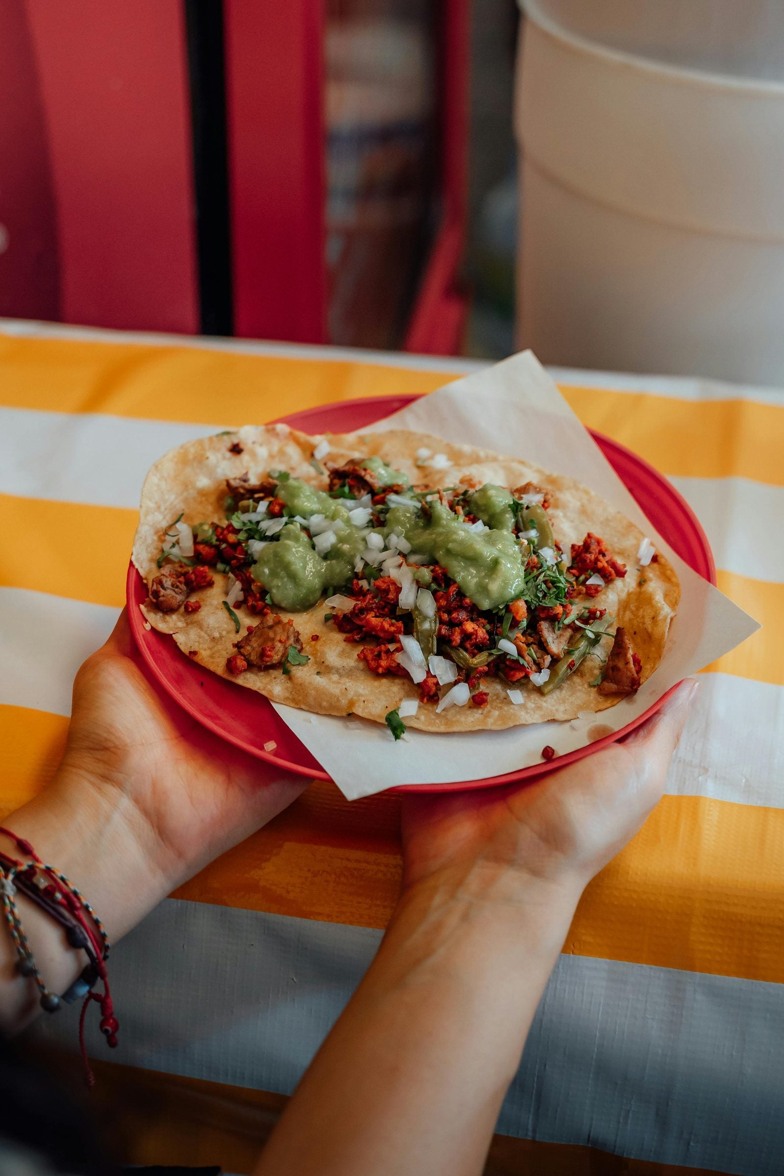 Mexican-style tacos on wooden plate with Papa Pastor seasoning